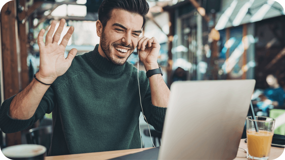 smiling young man having a video call