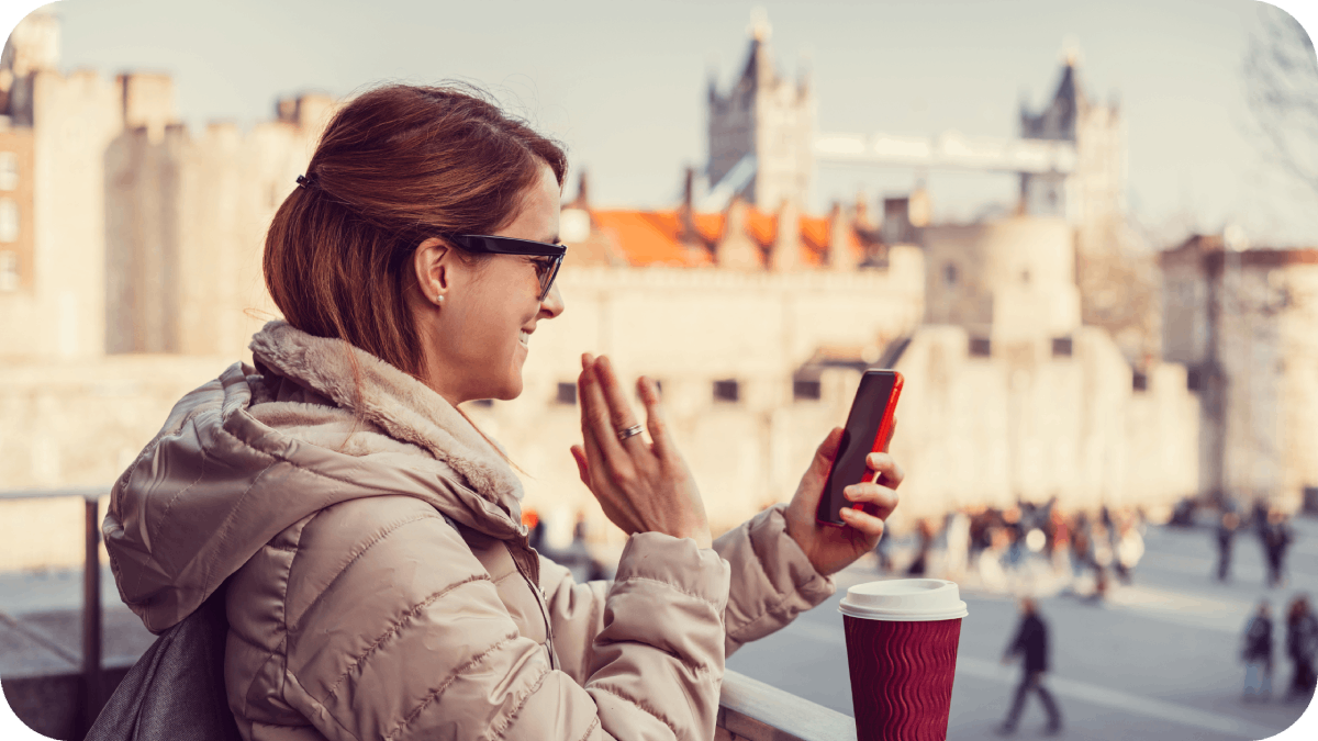 Smiling women waving with hand on video call