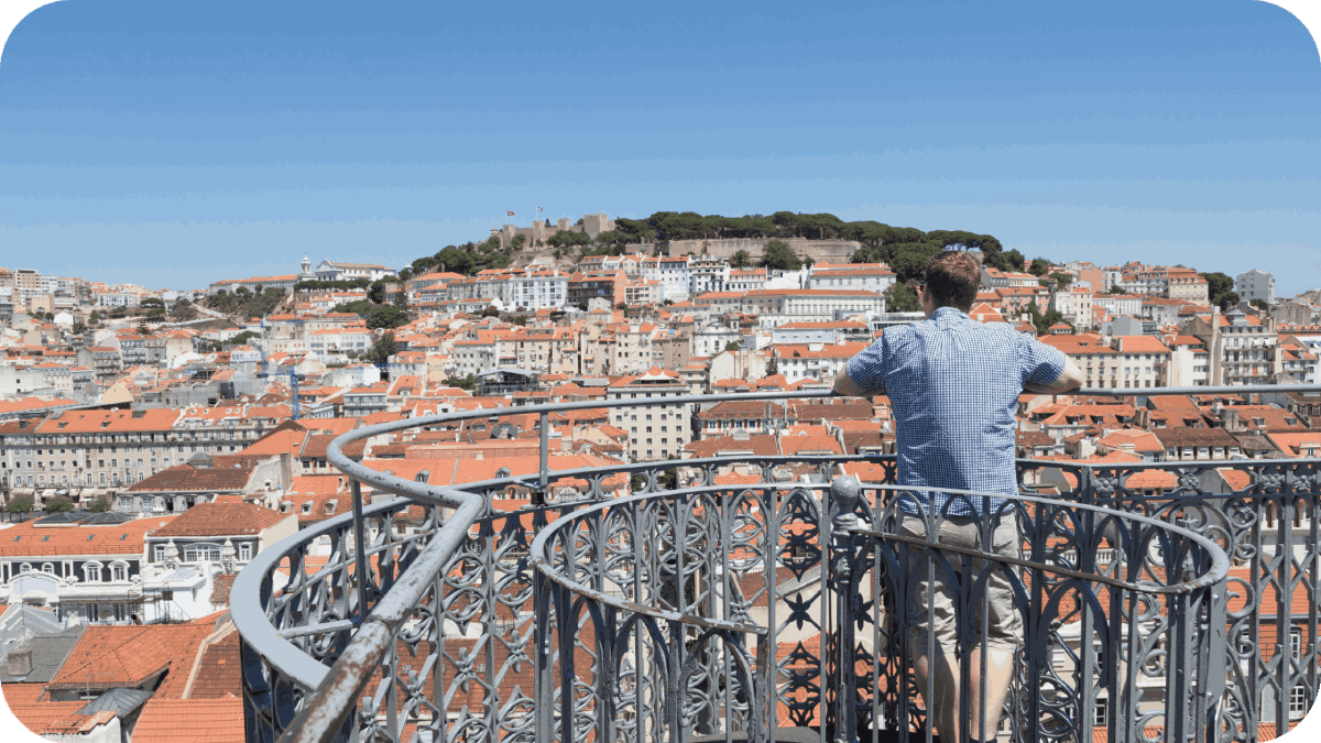 A tourist looks at a scenic view of Lisbon, the capitol of Portugal.