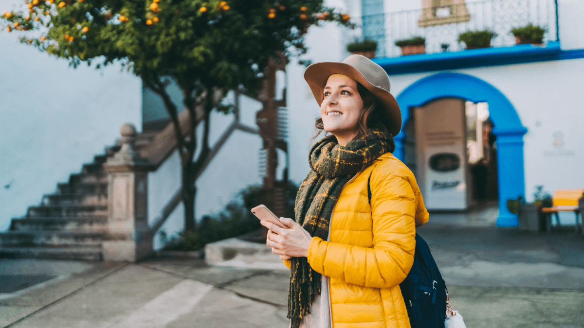 Women taking photos in Barcelona with smartphone