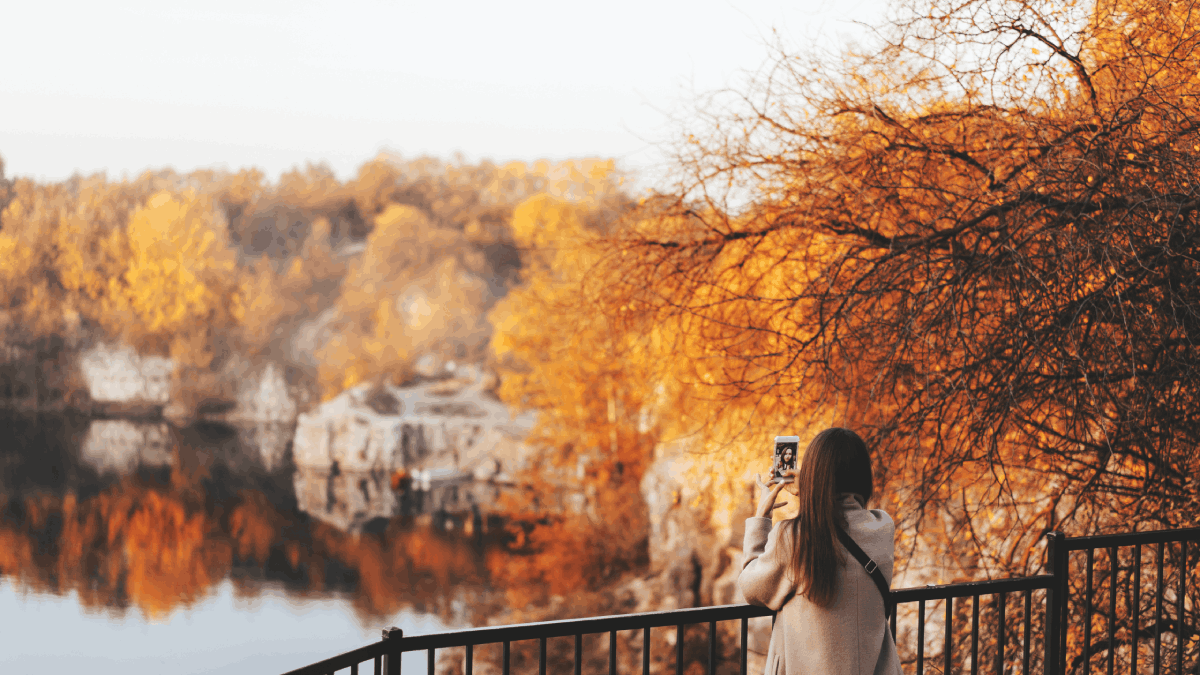 Woman Making Selfie in the Autumn Park