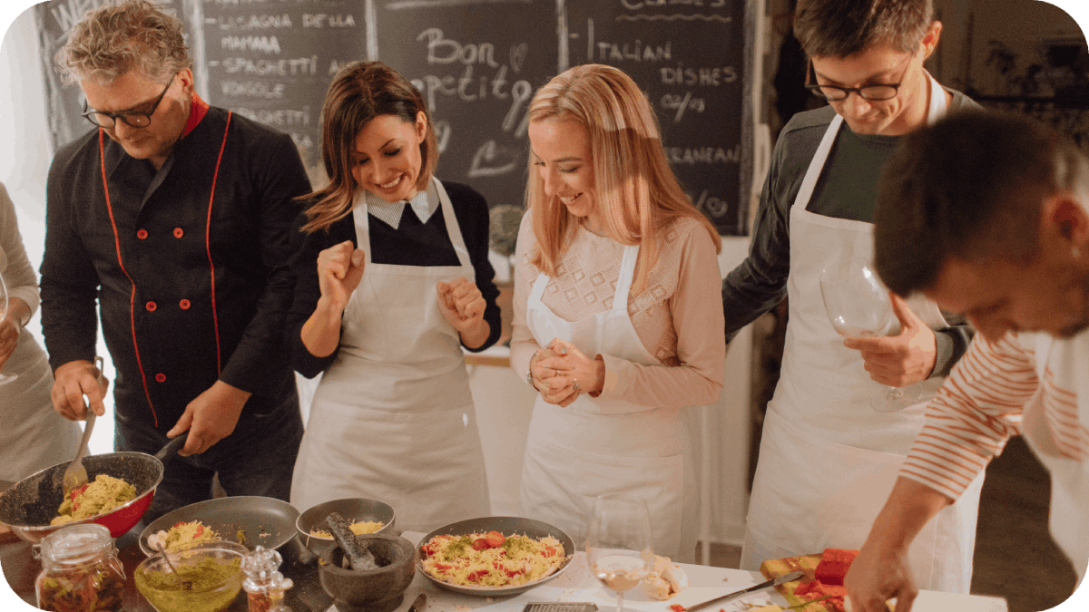 photo of a chef and his students in kitchen during a cooking class