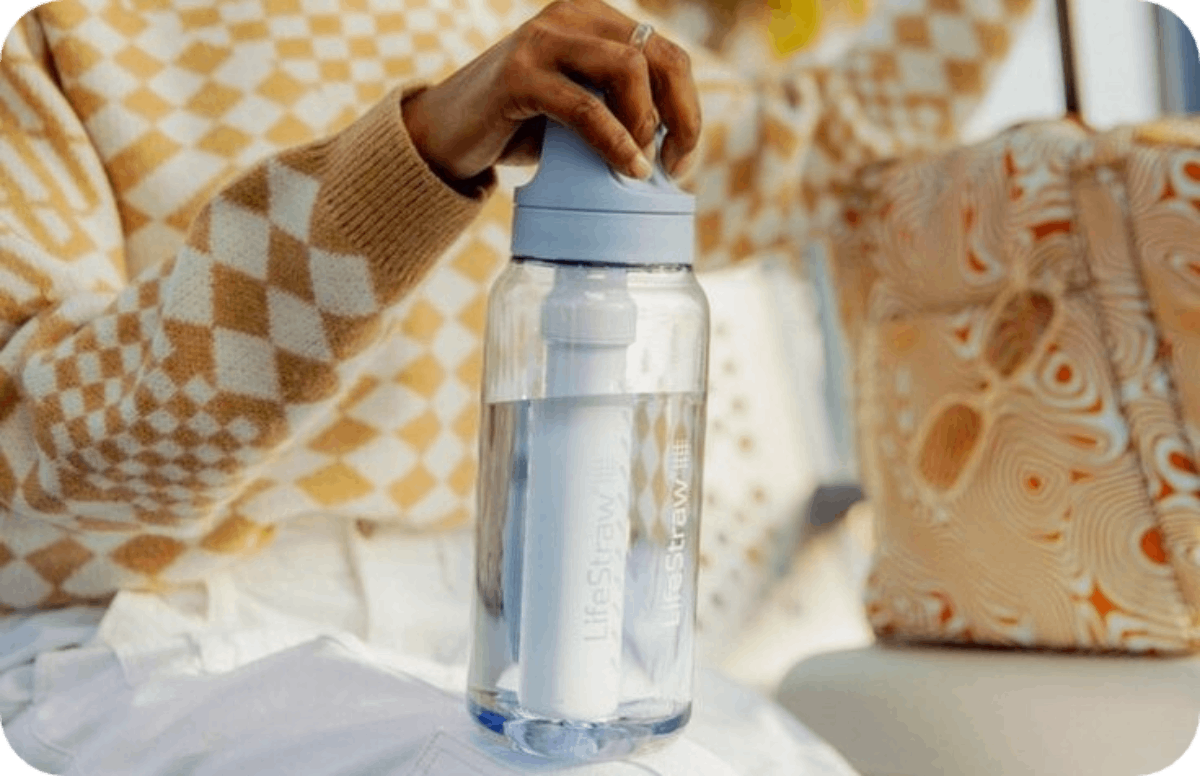 women holding LifeStraw Go Series 34-fl oz Plastic Water Bottle