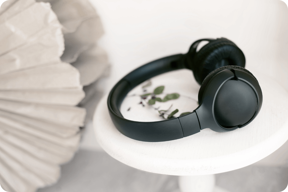 black wireless headphones on a white table 