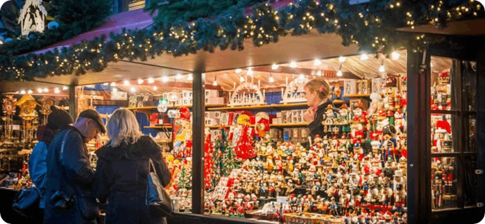 A festive market stall in Bruges, glowing with holiday cheer and offering handcrafted ornaments and seasonal delights.