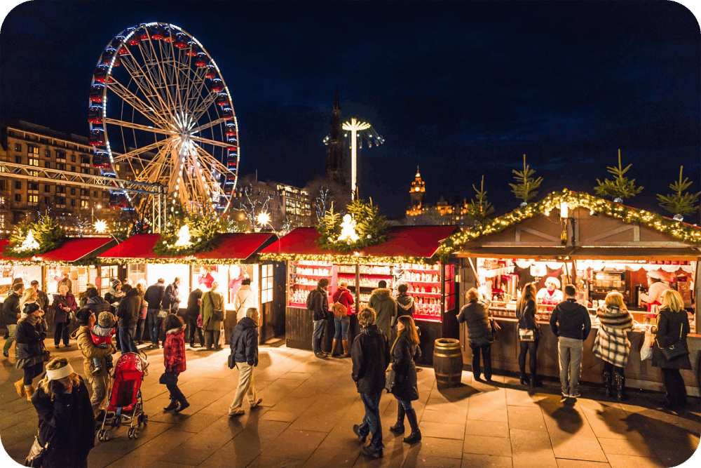 Edinburgh's Christmas Market with festive stalls and a dazzling Ferris wheel, offering a magical holiday atmosphere under twinkling lights.