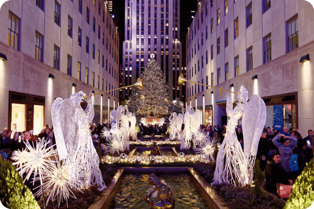 Rockefeller Center in New York City shines bright with its iconic Christmas tree, stunning angel decorations, and festive holiday atmosphere.