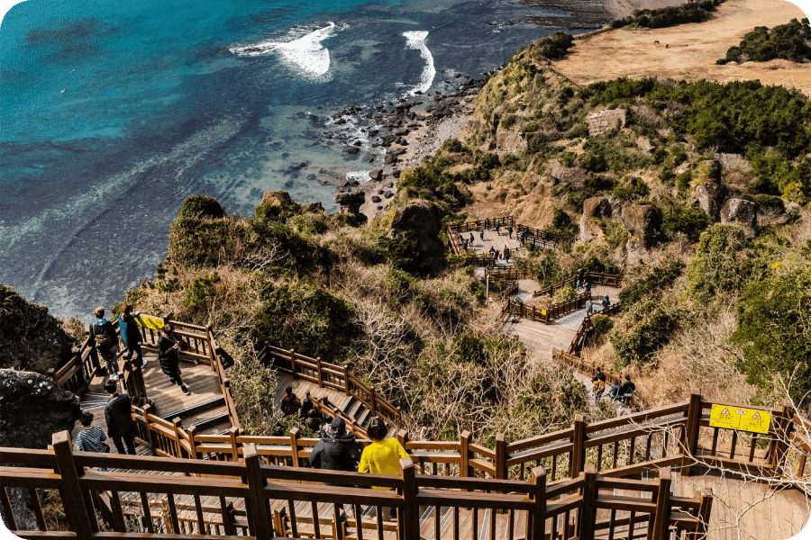 A breathtaking coastal hike with wooden stairways leading to stunning ocean views.